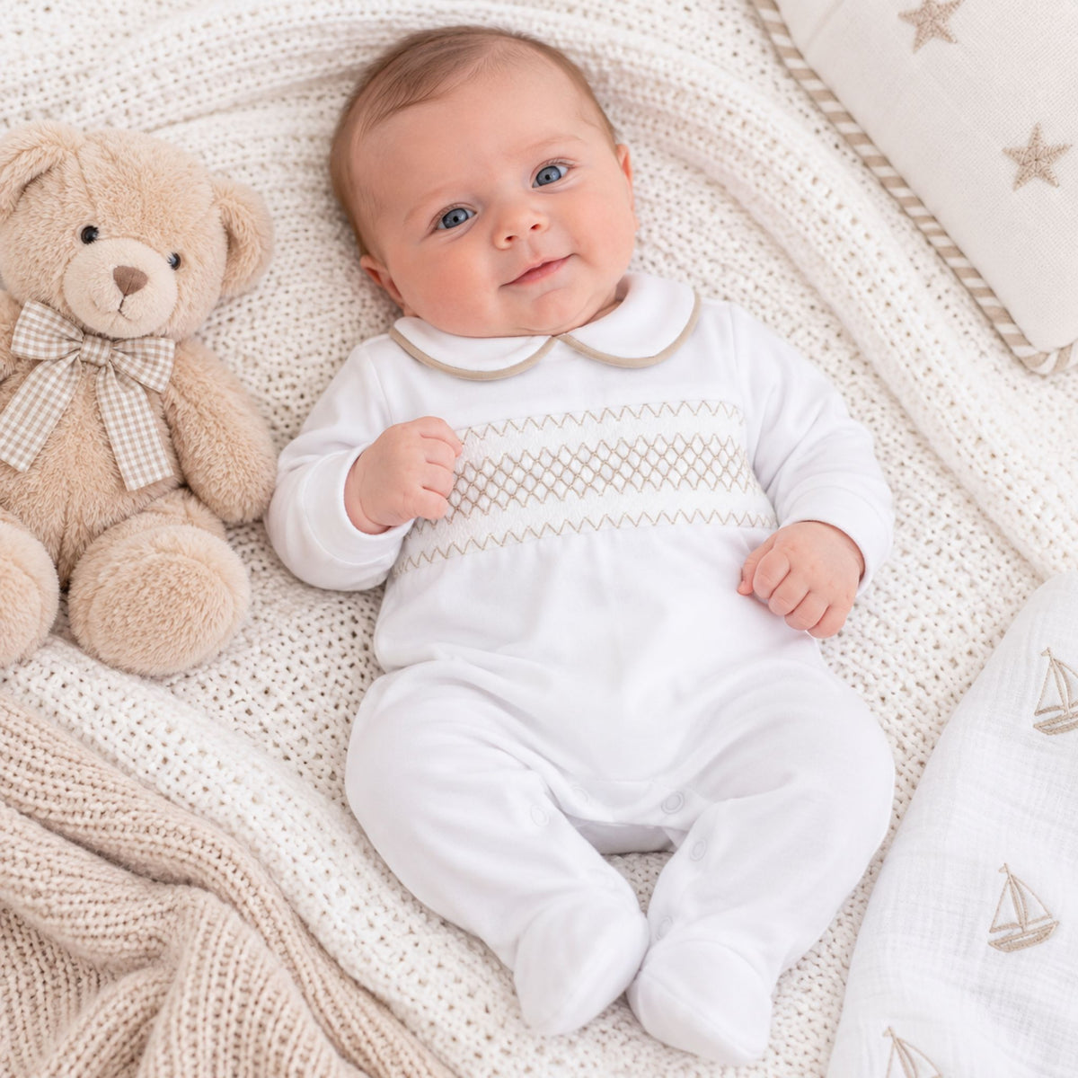 baby boy cotton babygrow in white with beige smocking