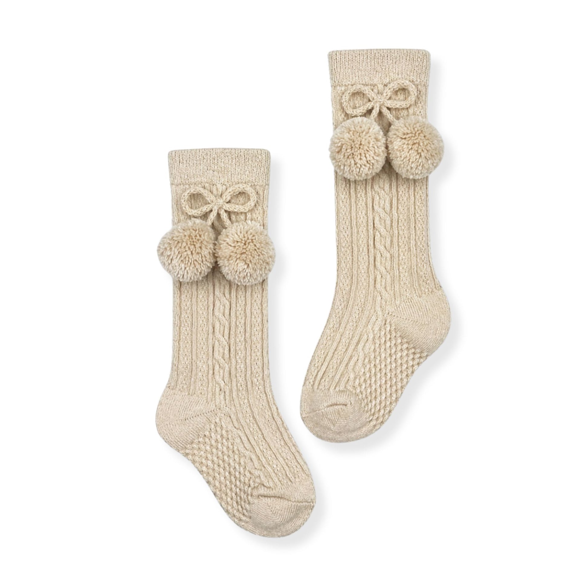 baby boys beige knee high socks with pom poms in a spanish style