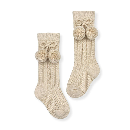 baby boys beige knee high socks with pom poms in a spanish style