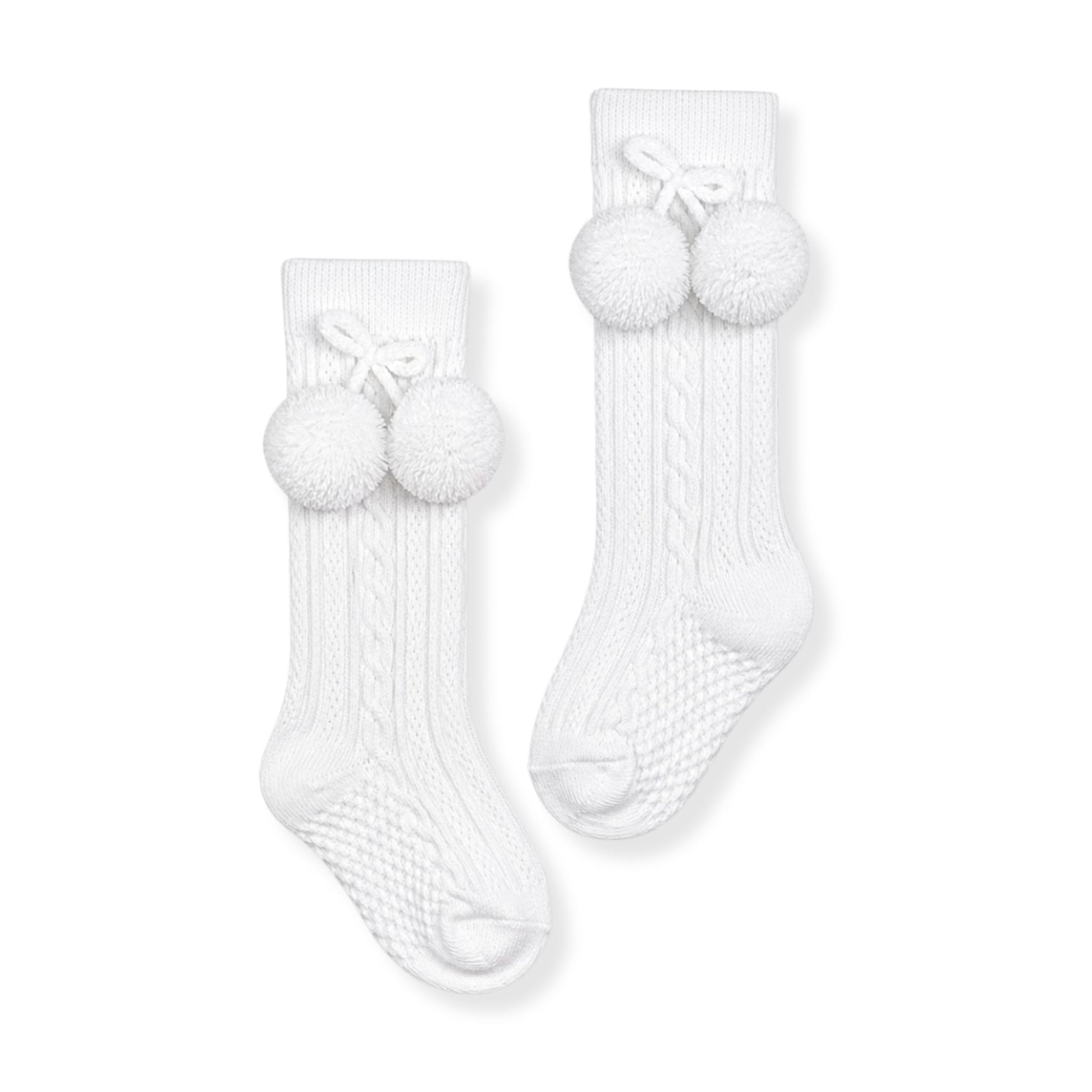 baby boy white  knee high pom pom socks in a spanish style
