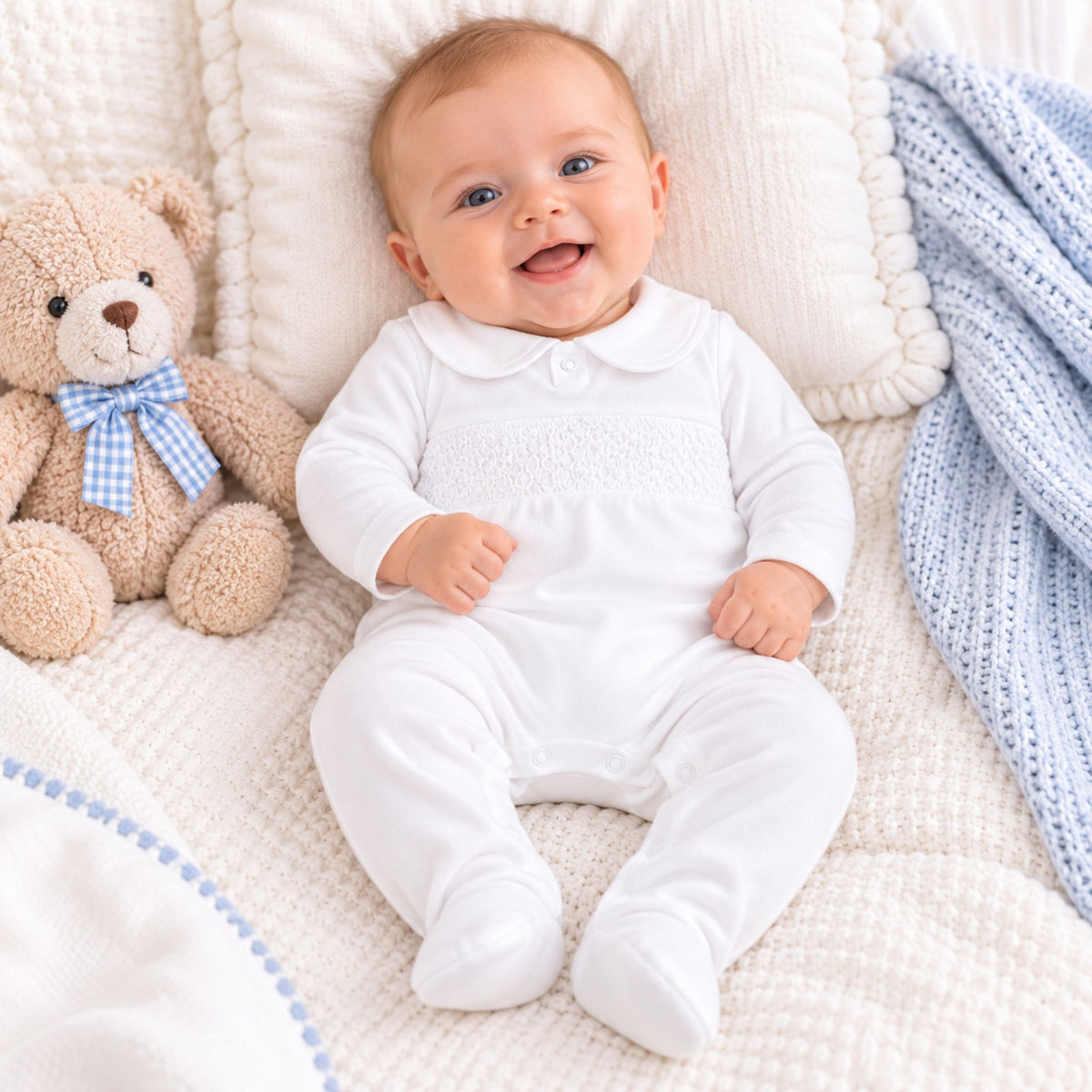 baby boy white sleepsuit with smocking