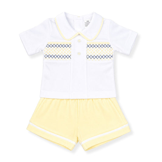 Children's outfit with white shirt and yellow shorts on a white background