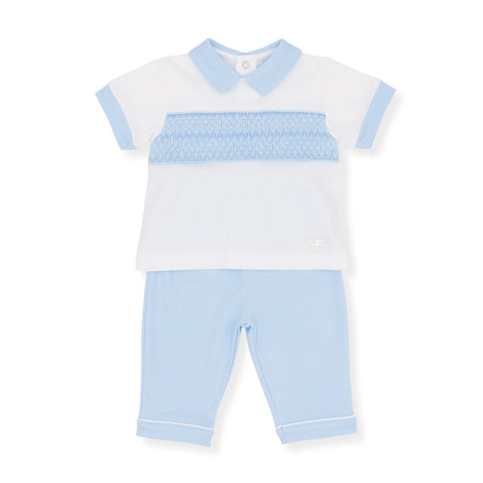 Children's outfit with white shirt and light blue pants on a white background