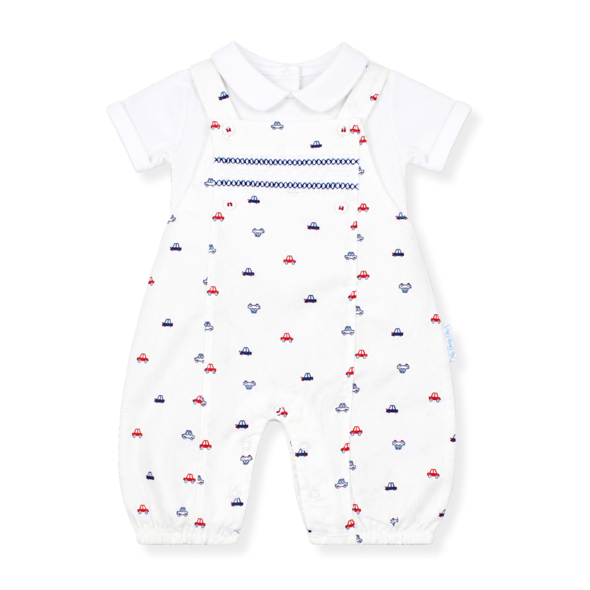 Whiite baby dungarees with car print with a white shirt on a white background