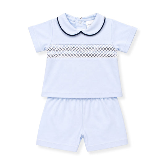 Light blue newborn outfit with a short-sleeve top and shorts on a white background