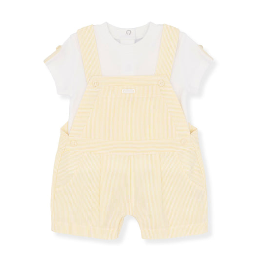 Yellow romper with white shirt on a white background