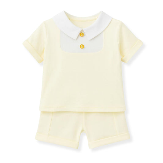 Yellow baby outfit with white collar and shorts on a white background