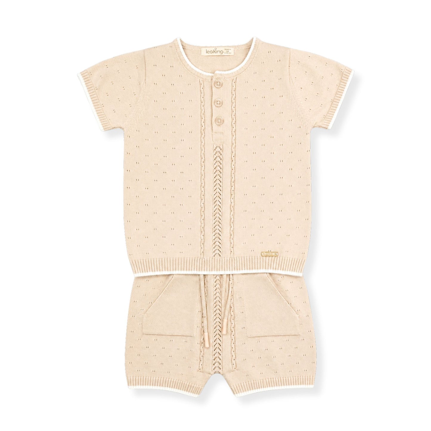 Beige baby outfit with short-sleeve top and shorts on a white background