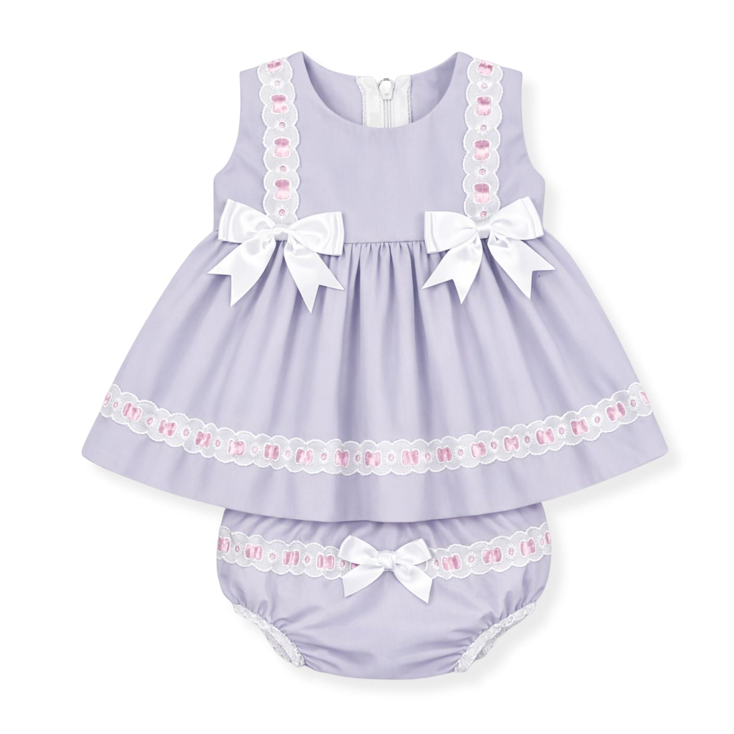 Lavender baby dress with white bows and lace details on a white background
