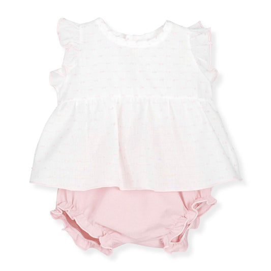 White sleeveless top and pink bloomers on a white background