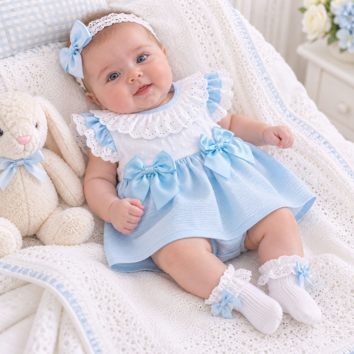 baby girl in blue dress