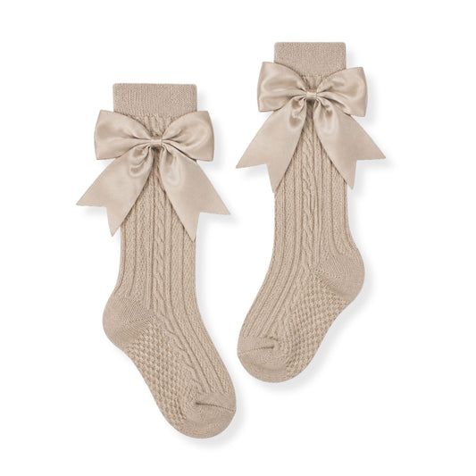 baby girl beige knee high sock with bows in a spanish style