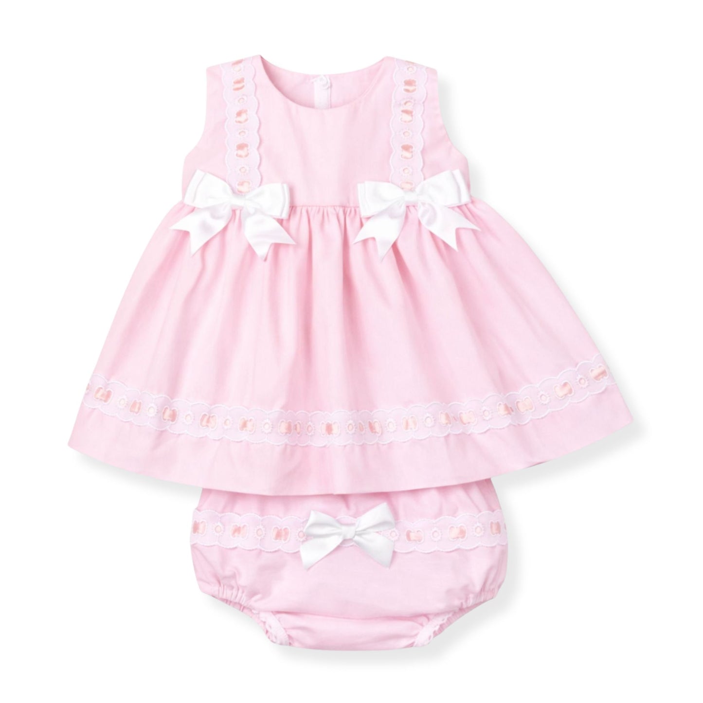 Pink baby dress with white bows on a white background