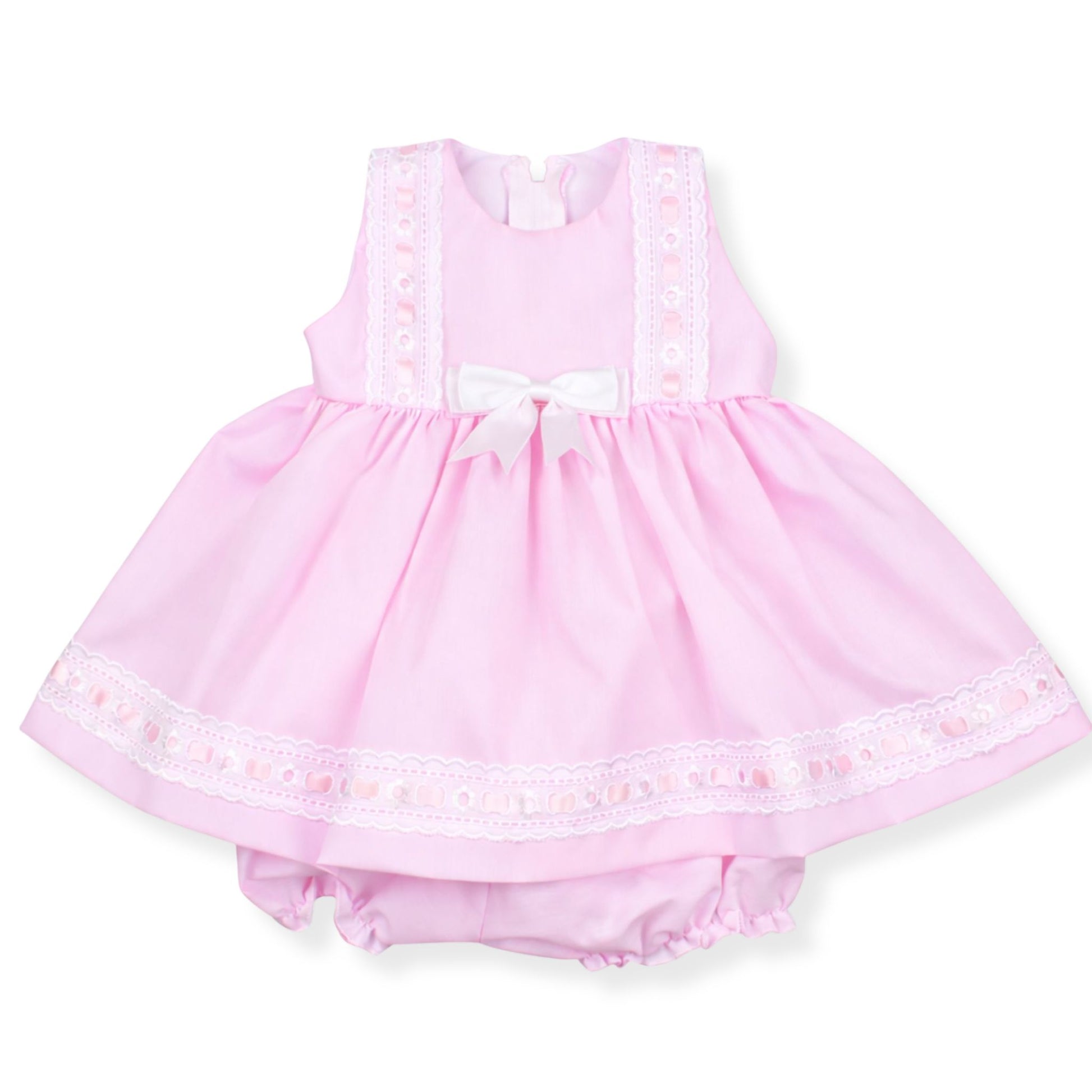 Pink baby dress with lace details on a white background