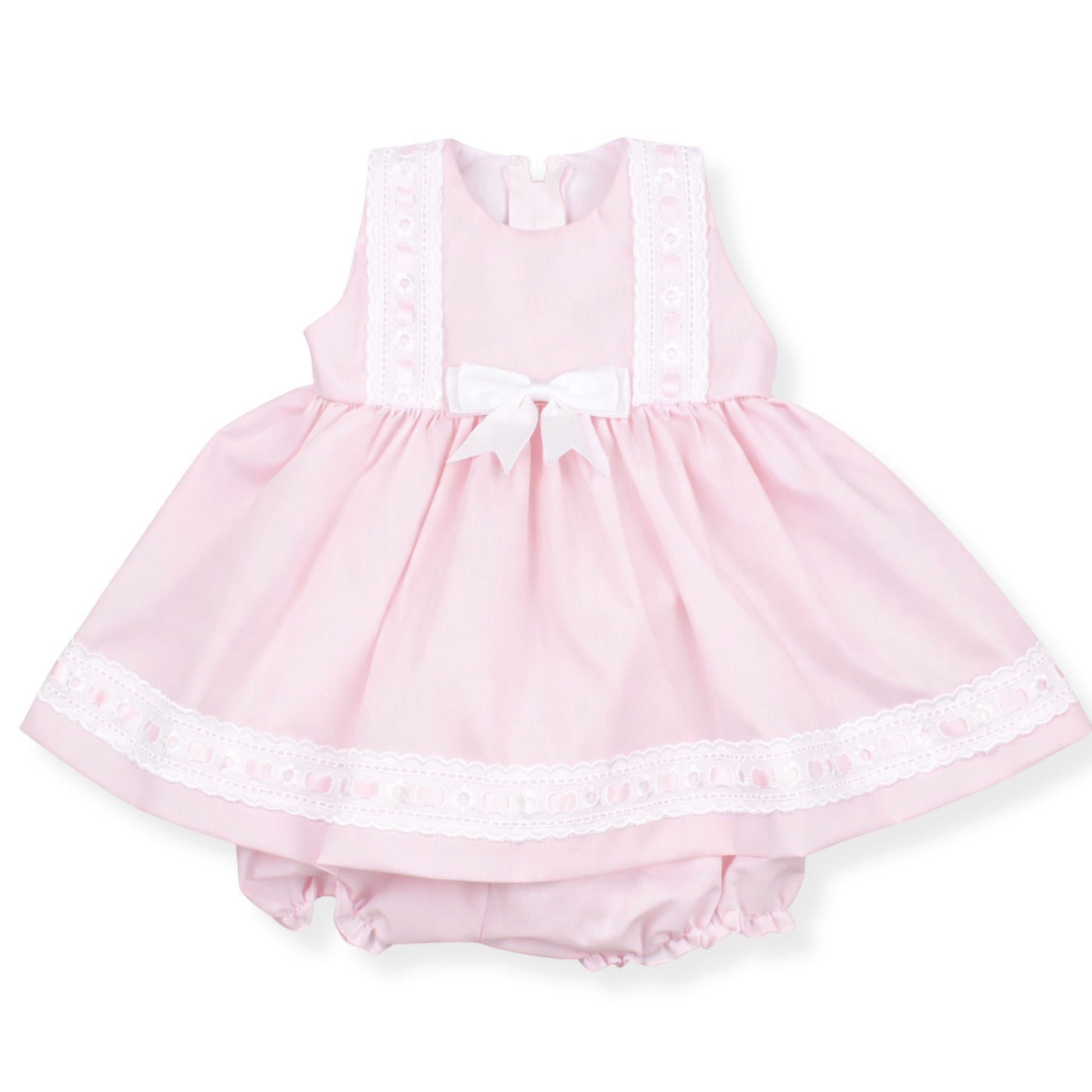 Pink baby dress with lace details on a white background