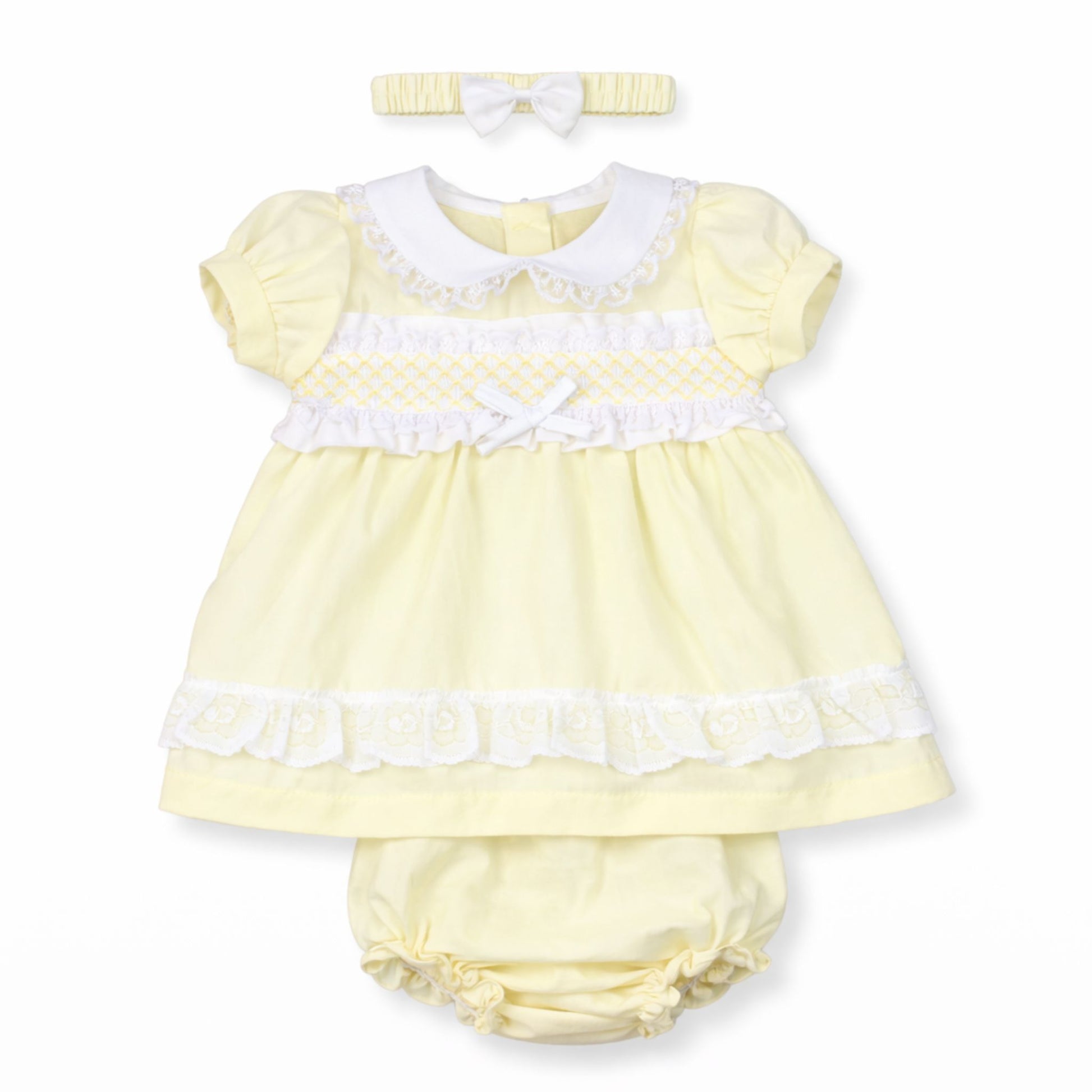 Yellow baby dress with white trim, matching headband, and bloomers on a white background