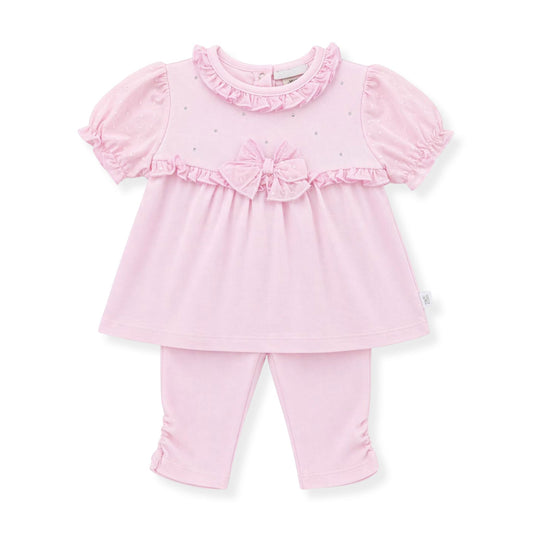 Pink baby outfit with top and leggings on a white background