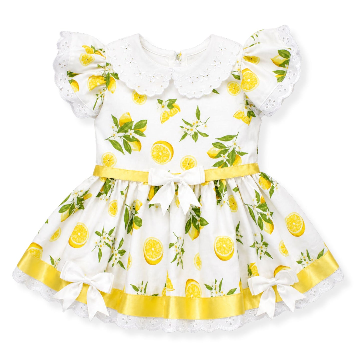 Children's dress with lemon print on a white background