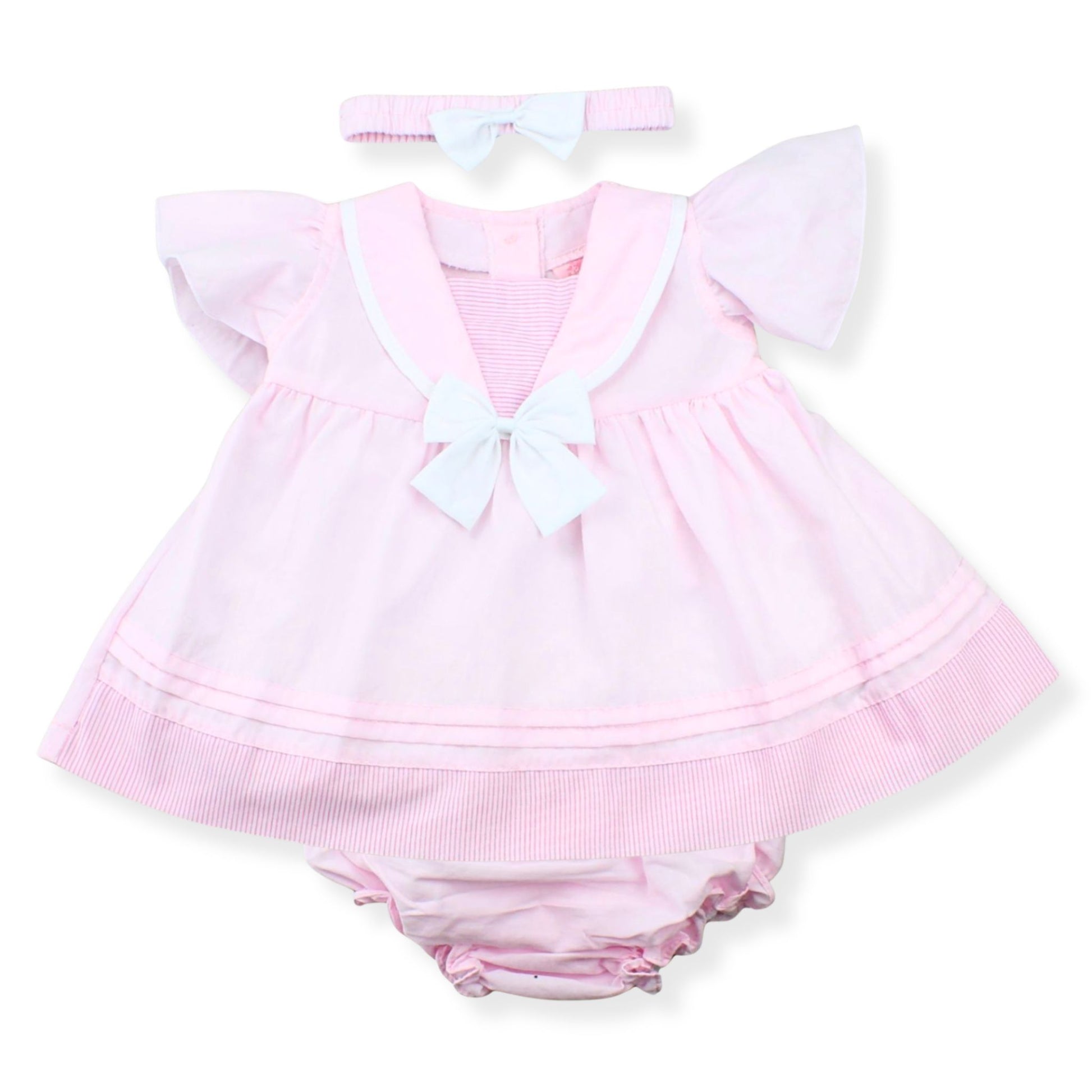 Pink baby outfit with a dress and bloomers on a white background