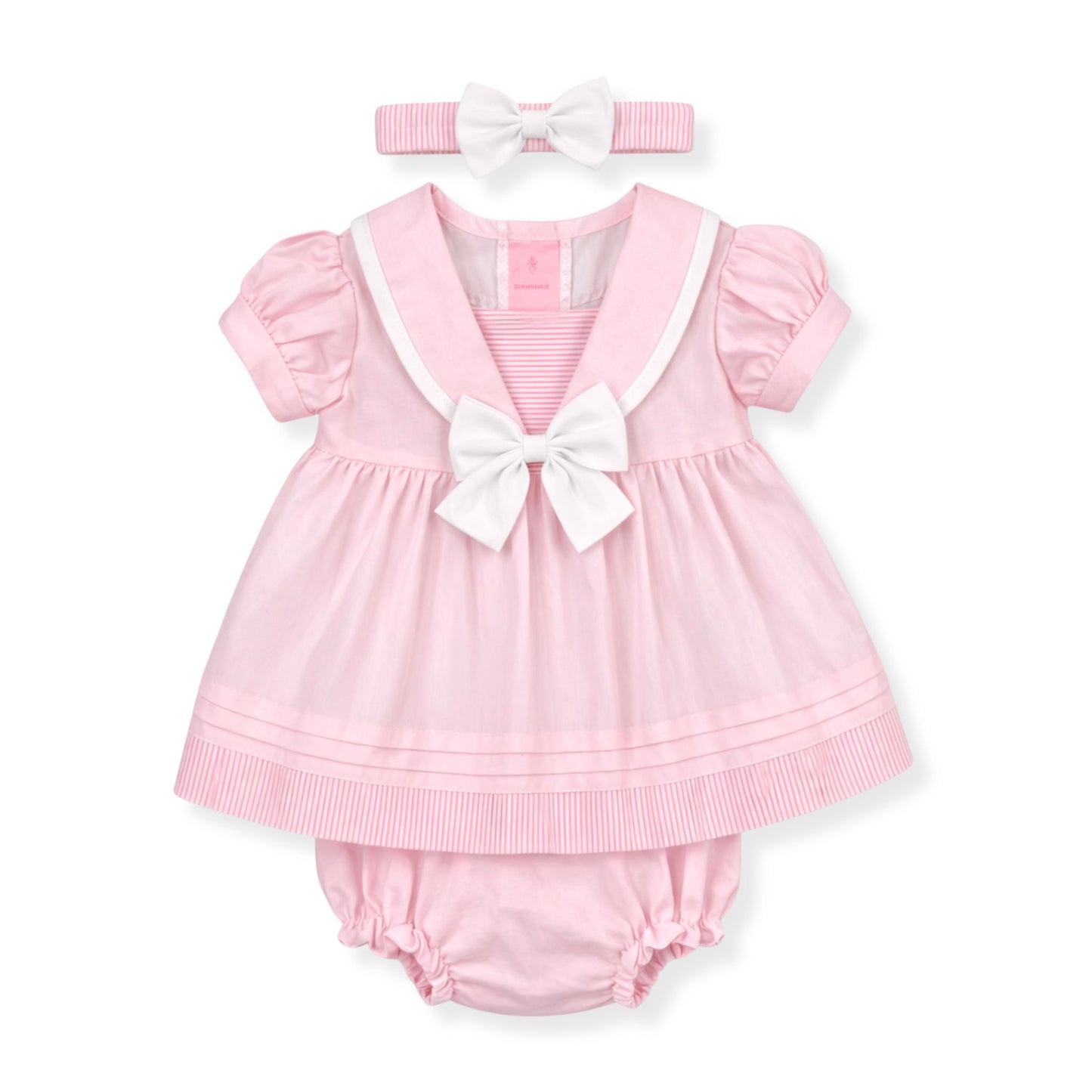 Pink baby outfit with a dress and bloomers on a white background