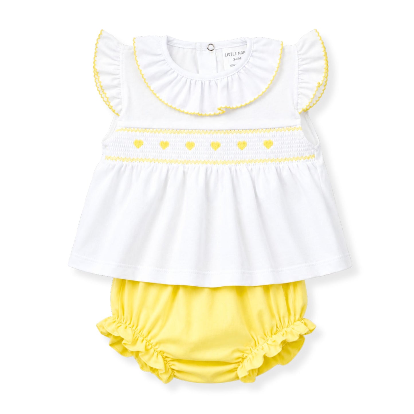 White top with yellow trim and yellow bloomers on a white background