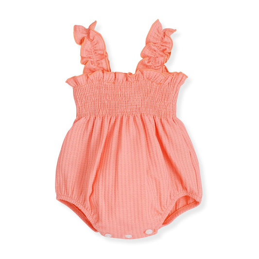 Coral baby romper with ruffled straps on a white background