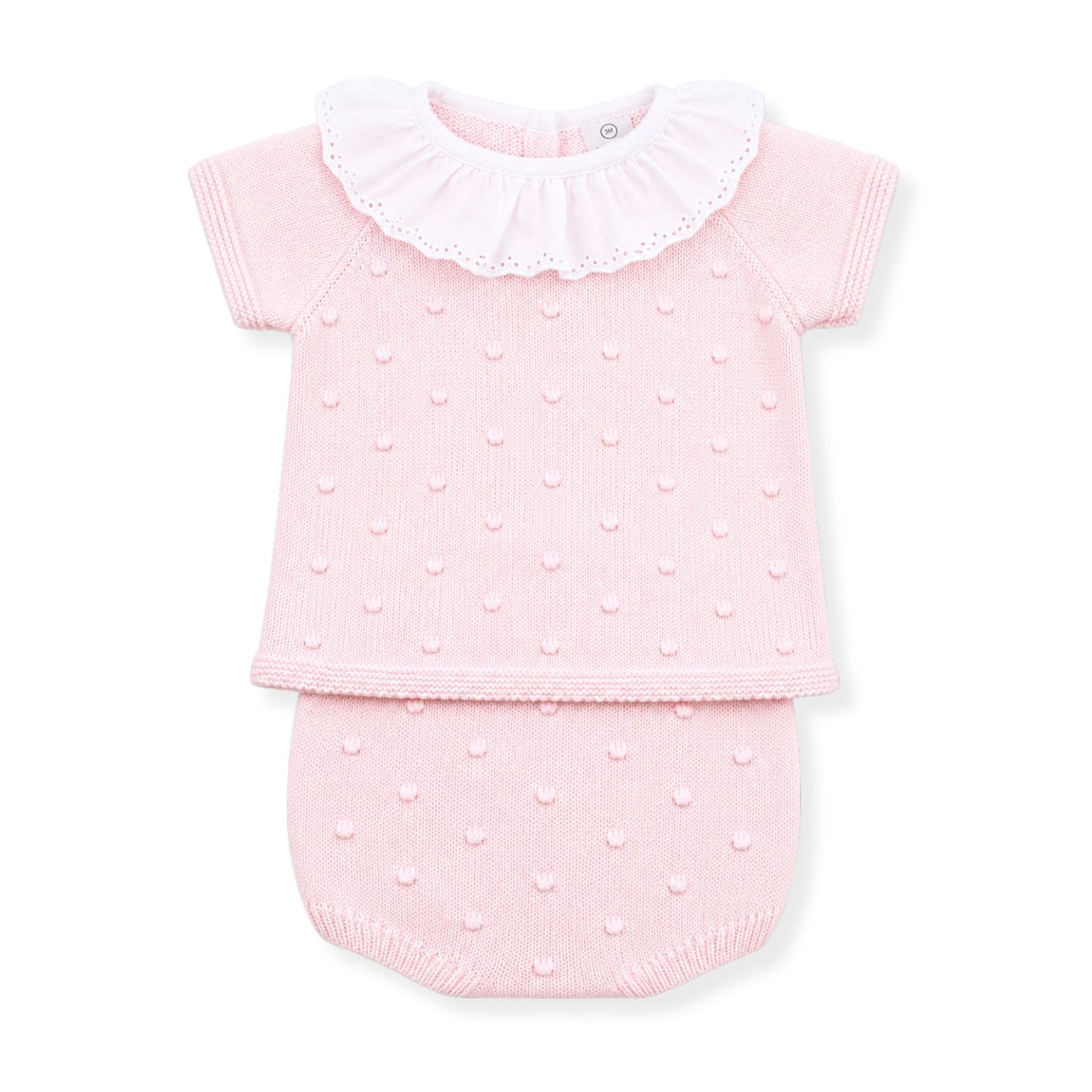 Pink baby outfit with ruffled collar on a white background