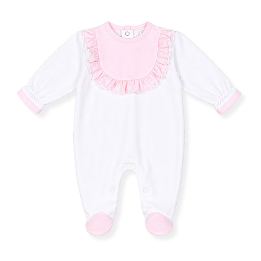 White baby onesie with pink ruffled collar on a white background
