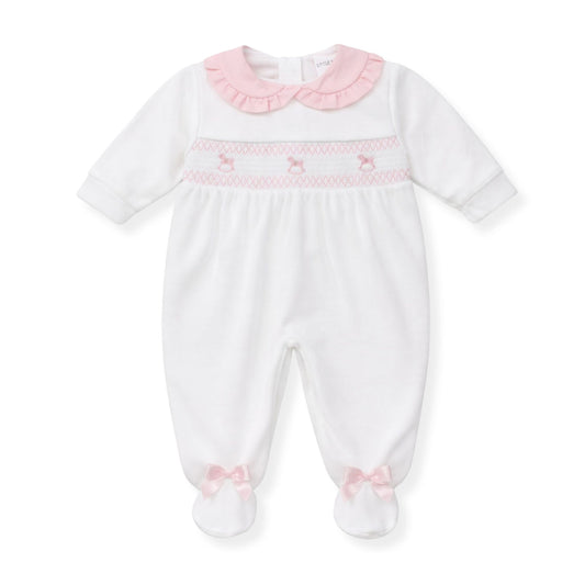 White baby sleepwith pink trim and embroidery on a white backgrounduit 