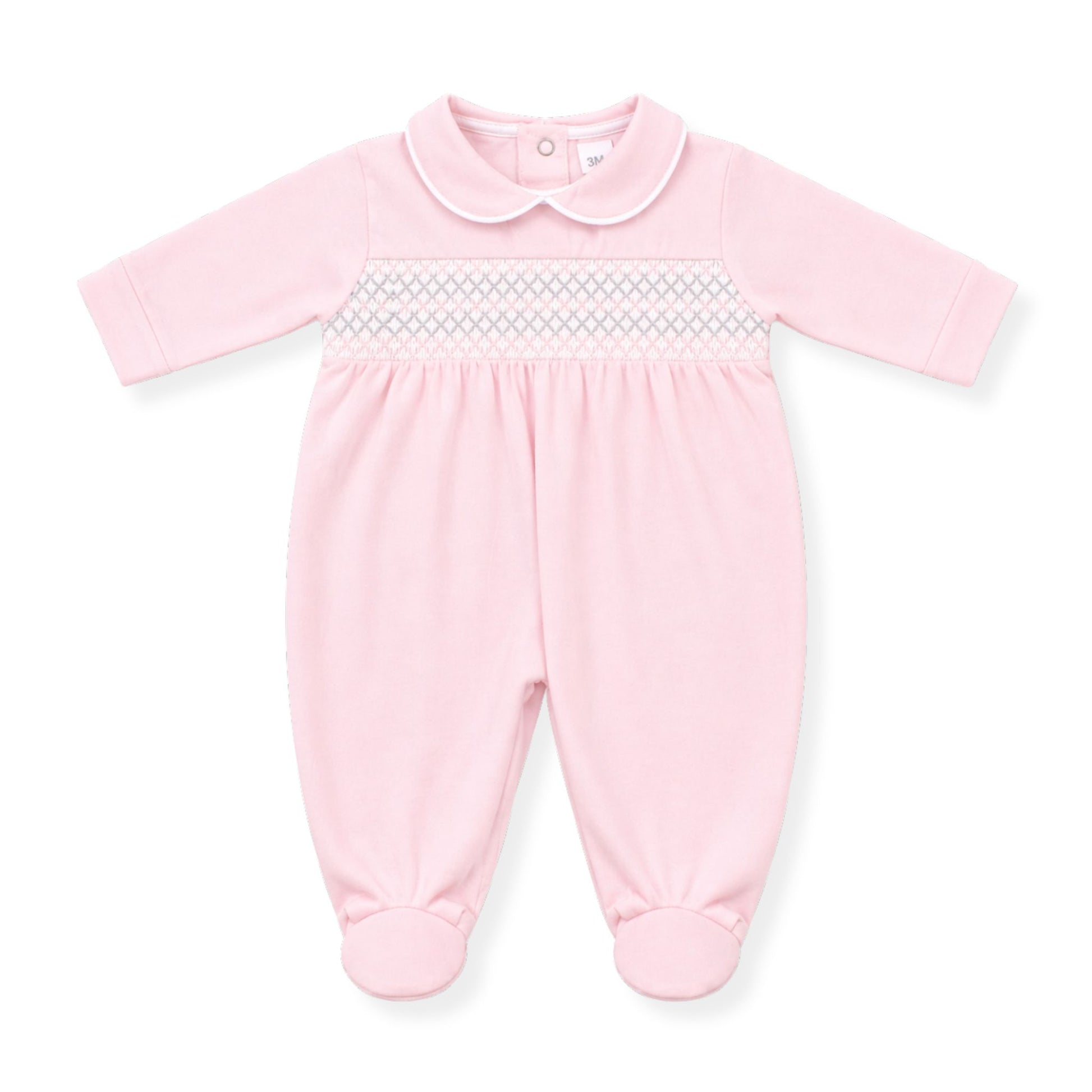 Pink baby girls’ babygrow with Peter Pan collar and delicate smocking detail across the chest, long sleeves and footed design, photographed on a clean white background