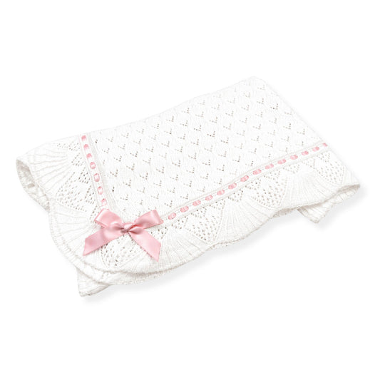 White baby blanket with pink bow 