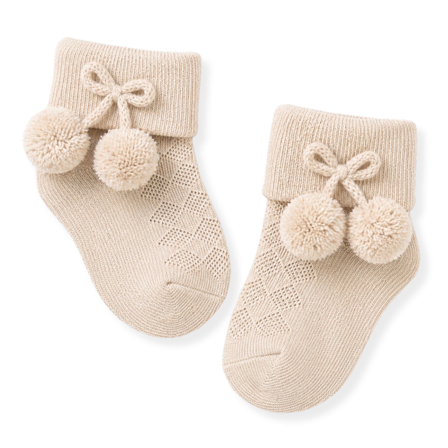 beige ankle pom socks for a baby
