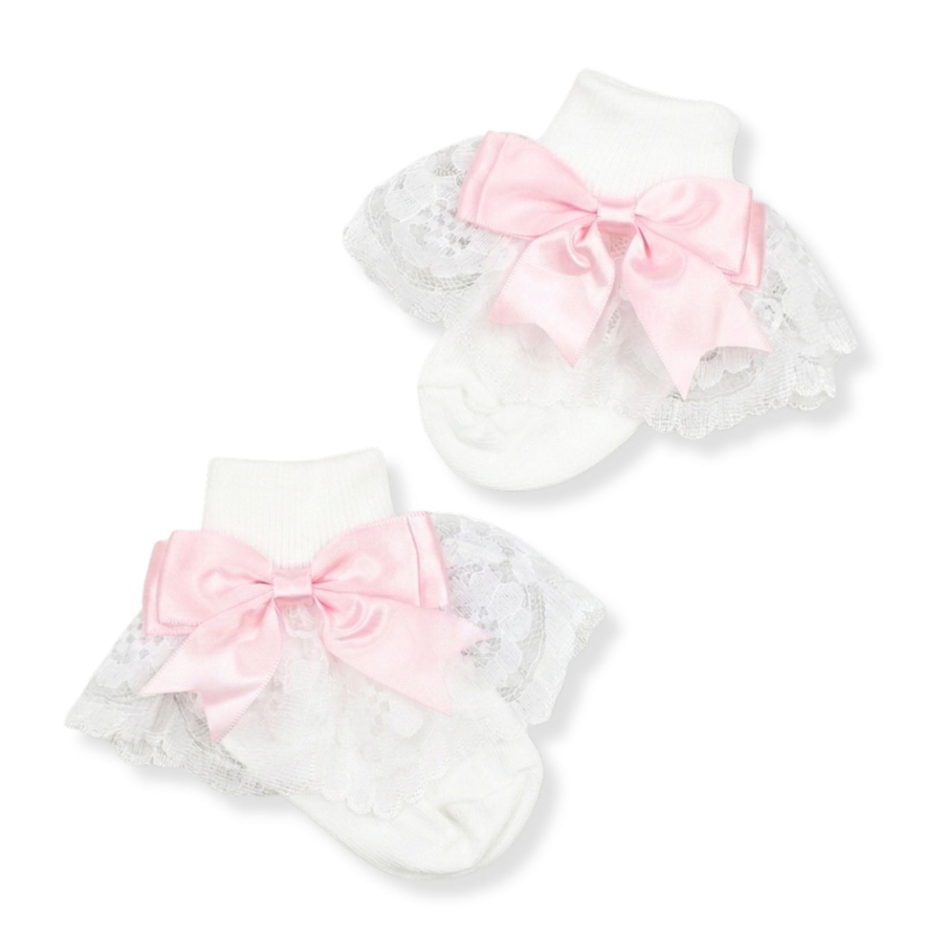 baby girls white frilly fancy socks ith a pink bow in a spanish style