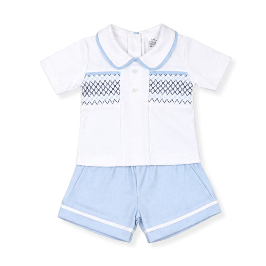 Children's outfit with white shirt and light blue shorts on a white background