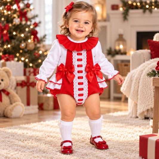 Baby girl wearing red frill romper and white blouse two piece outfit
