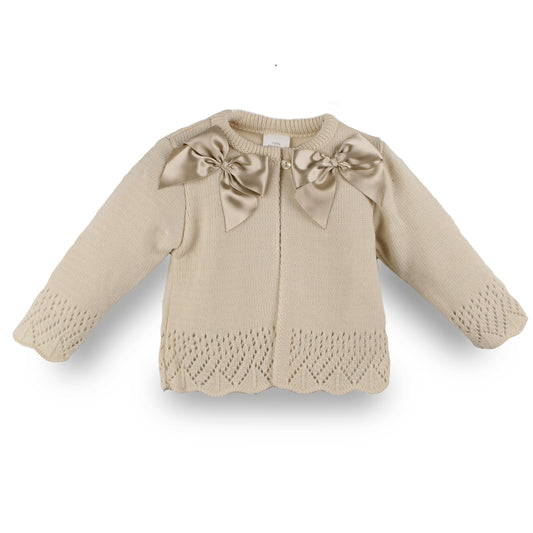 beige baby girls knitted cardigan in a spanish style with 2 bows