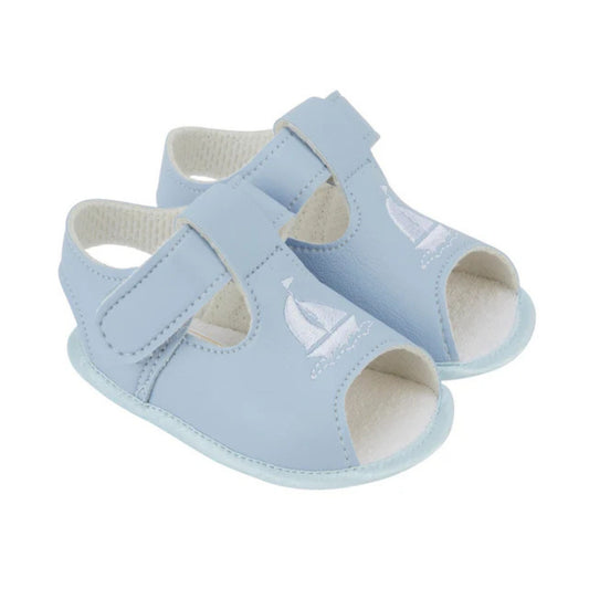 Pair of light blue baby sandals with a sailboat design on a white background