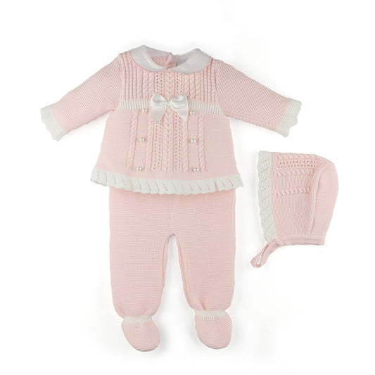 Pink baby outfit with matching hat on a white background