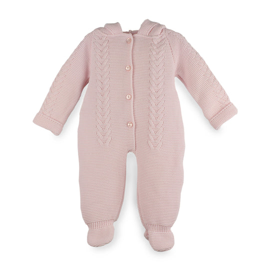 Pink knitted baby romper with cable patterns on a white background