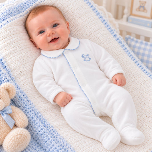 white velour sleepsuit with rocking horse