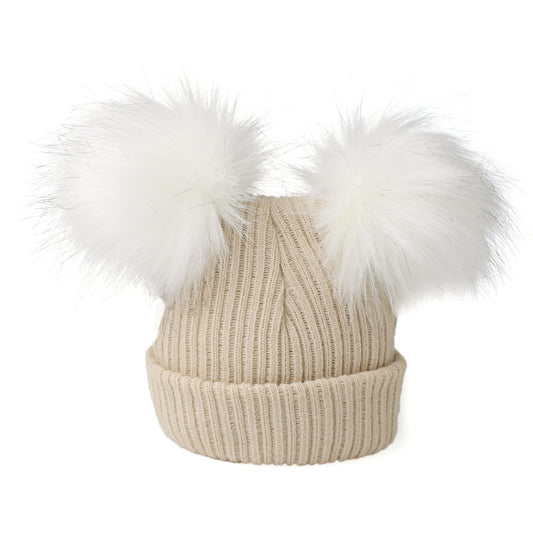 Beige knit beanie with white fur pom-poms on a white background