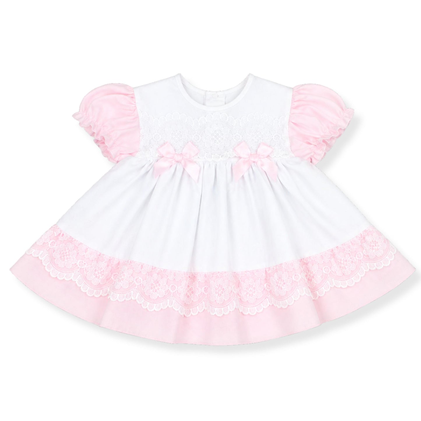 White dress with pink ruffled sleeves and hem on a white background