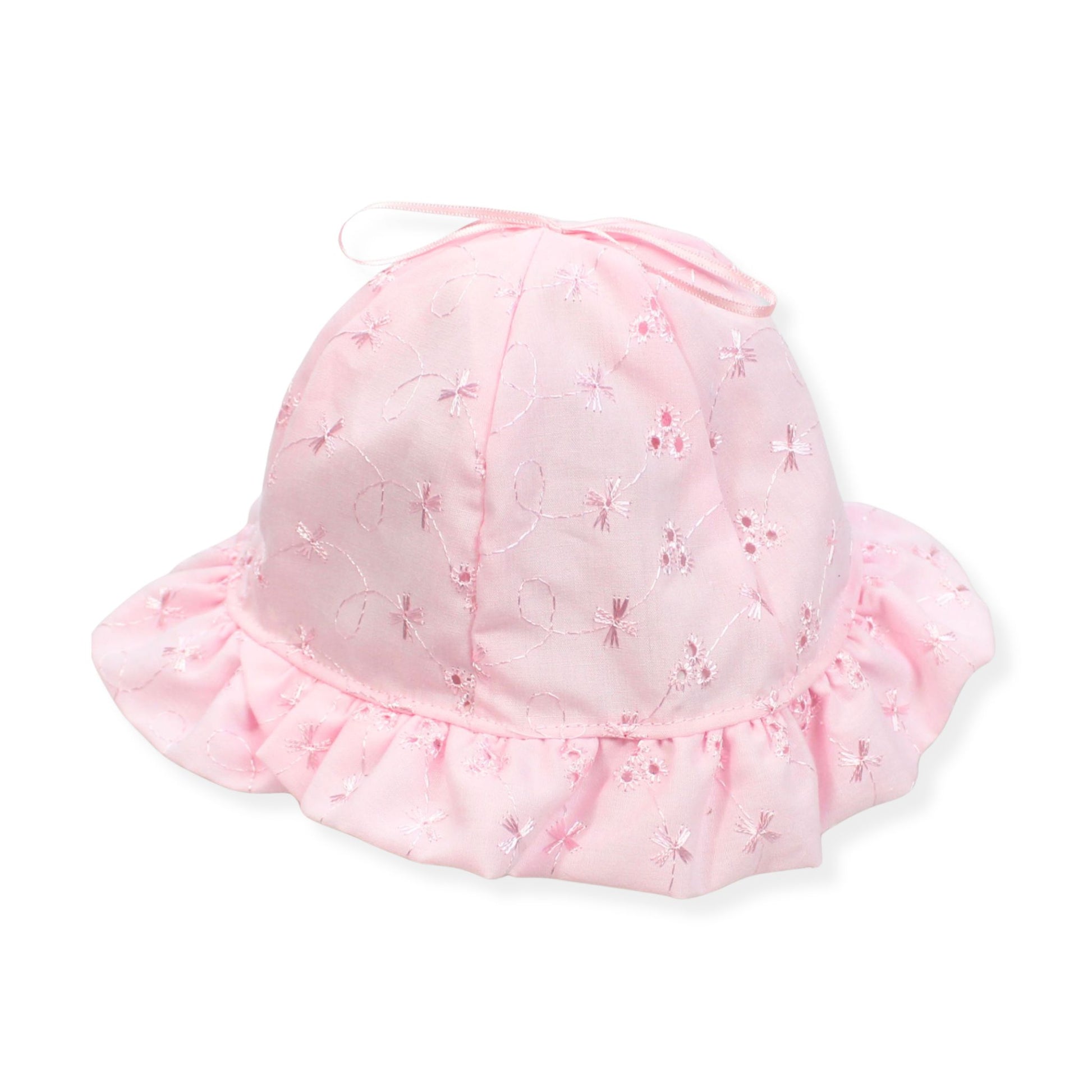 Pink baby hat with ruffled brim on a white background