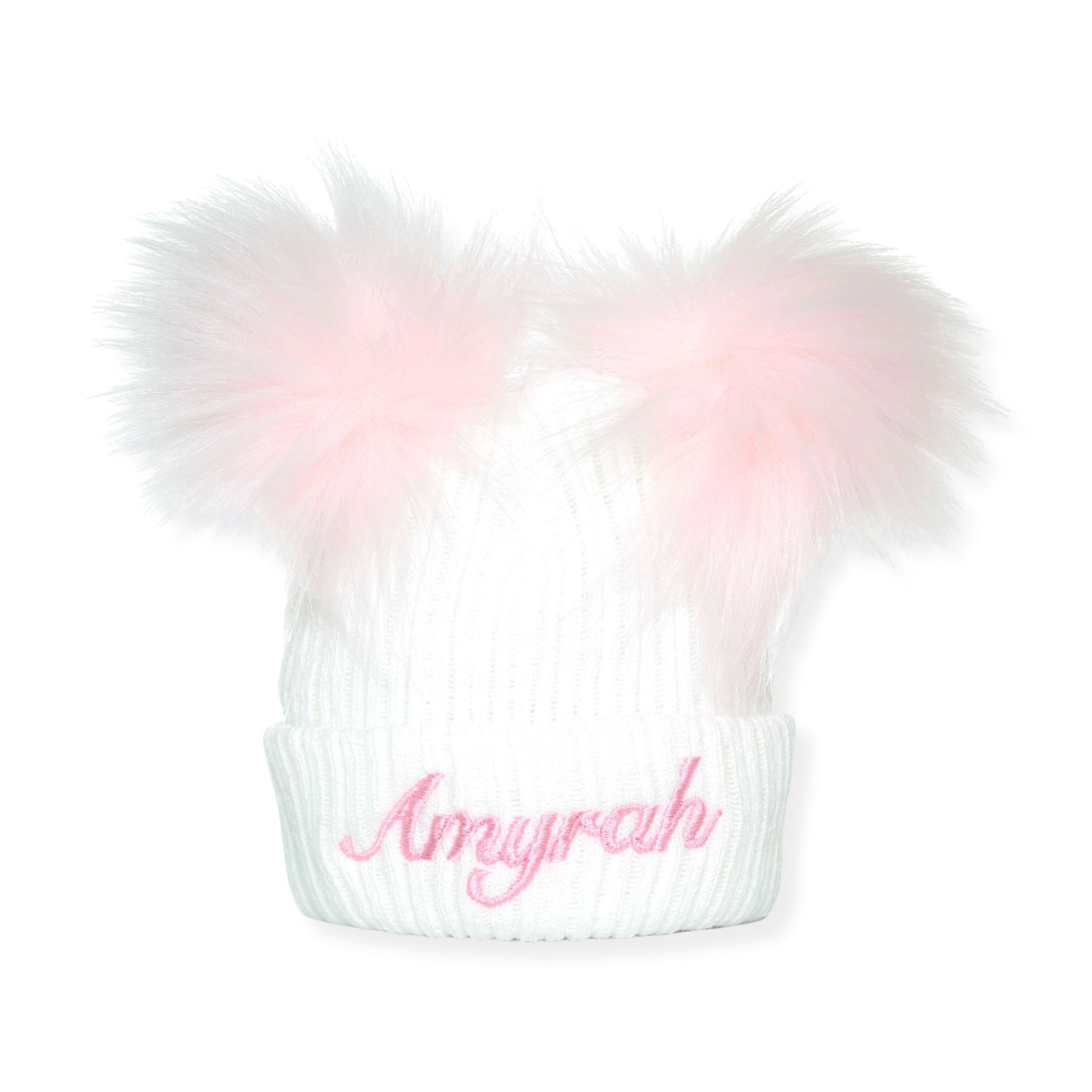 White beanie with pink fur pom-pom and embroidered name on a white background