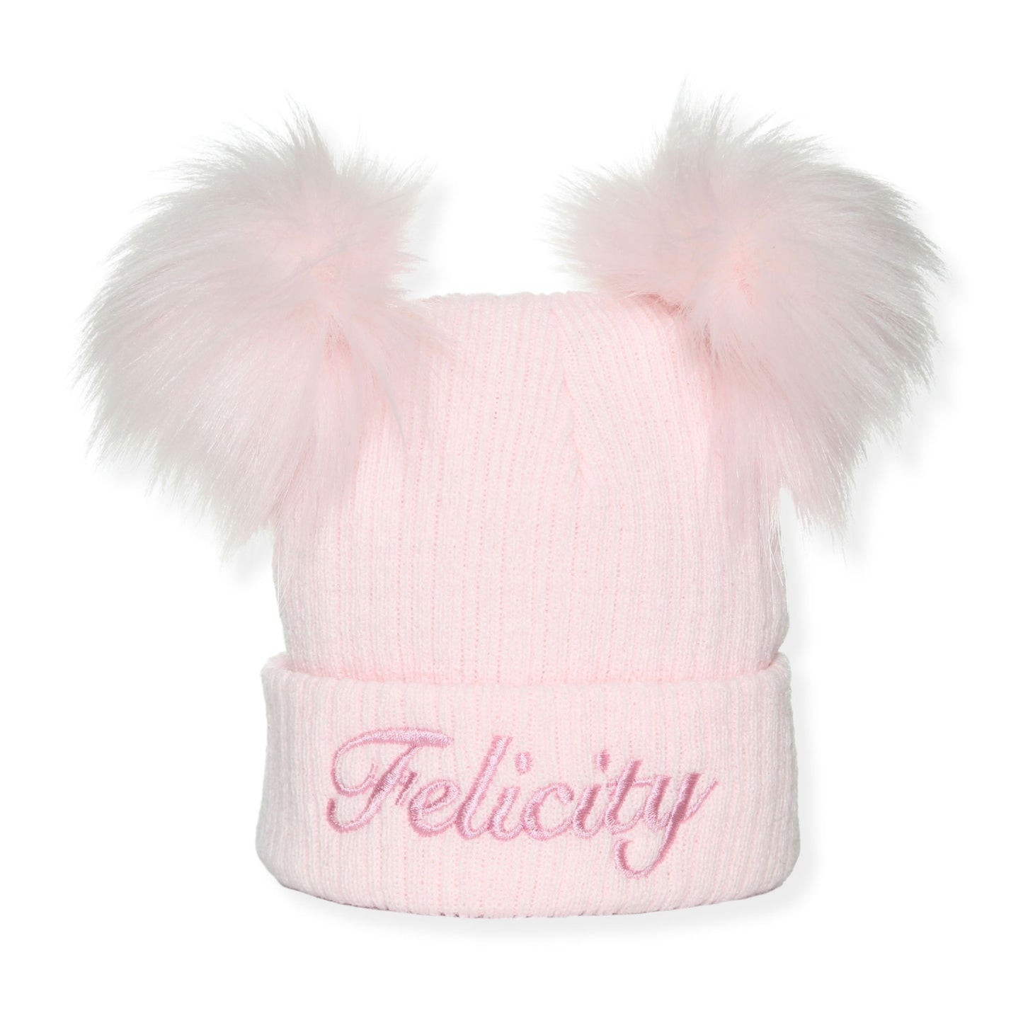 Pink knit beanie with two large fur pom-poms and 'Felicity' embroidery on a white background