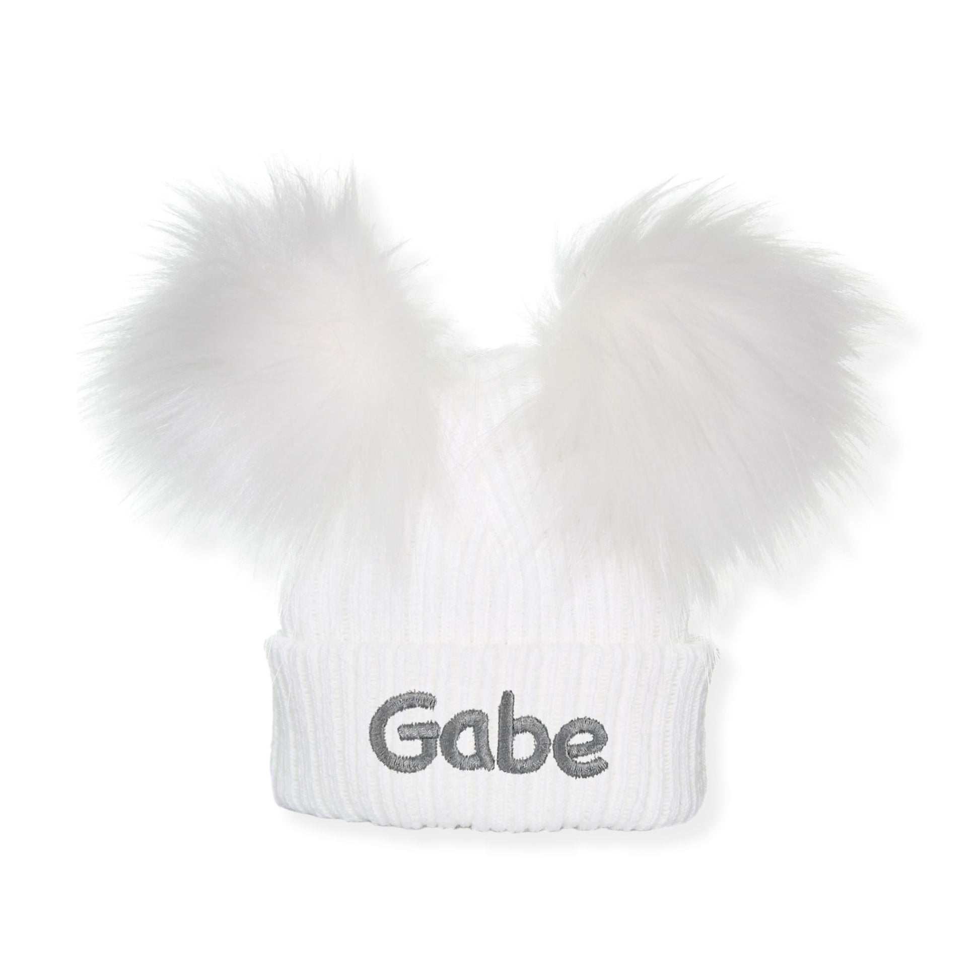 White beanie with fur pom-pom and 'Gabe' embroidery on a white background