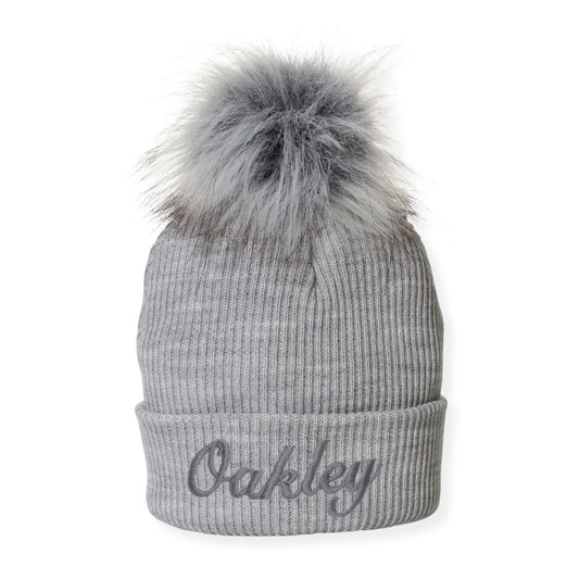 Gray beanie with a fur pom-pom on a white background
