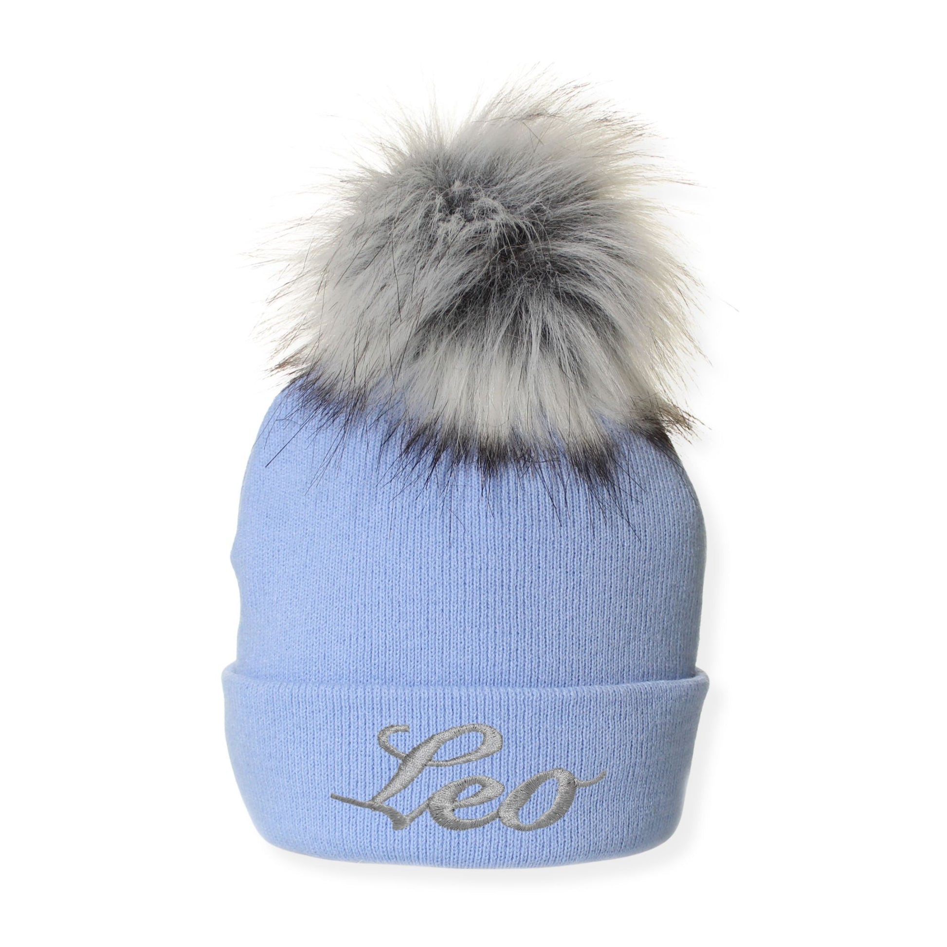 Light blue beanie with gray fur pom-pom and 'Leo' embroidery on a white background