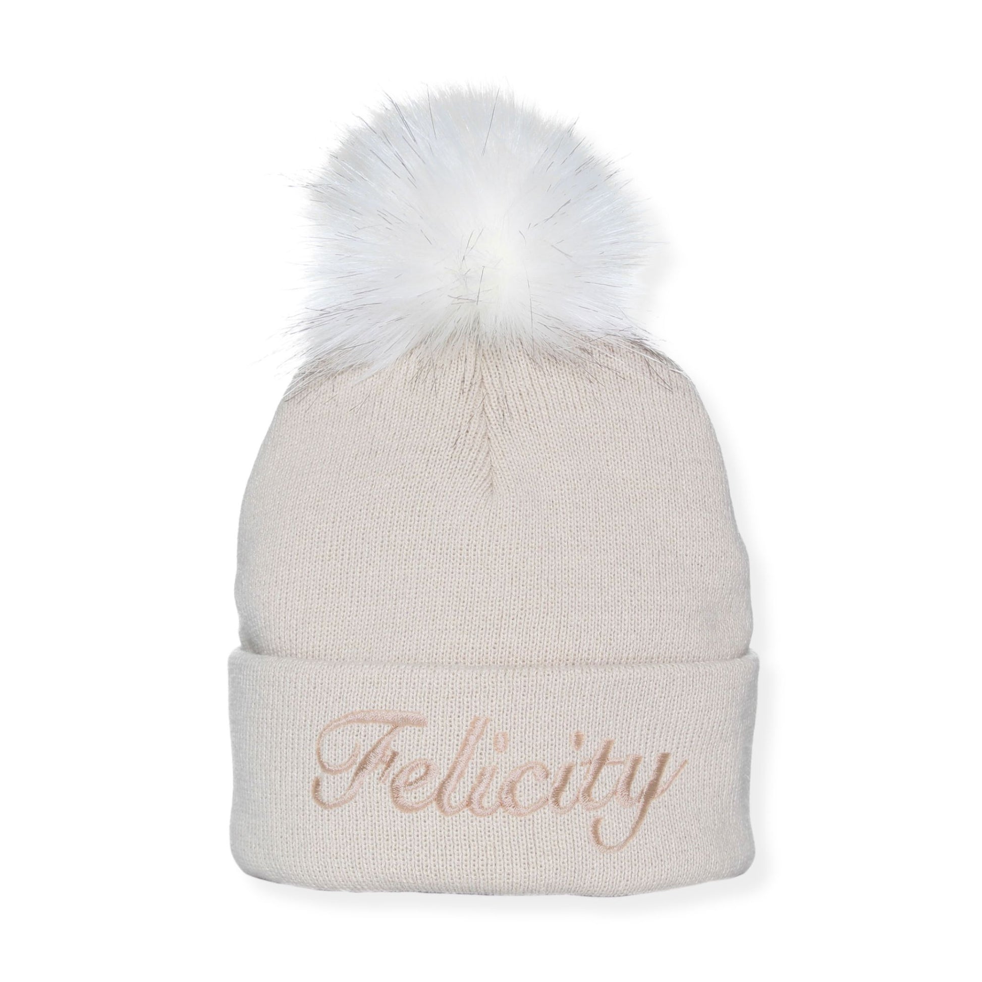 Beige beanie with white fur pom-pom and 'Felicity' embroidery on a white background