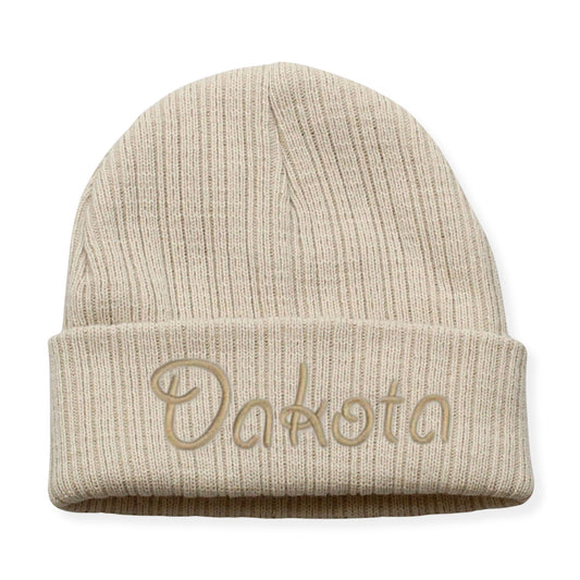 Beige beanie with 'Dakota' embroidery on a white background